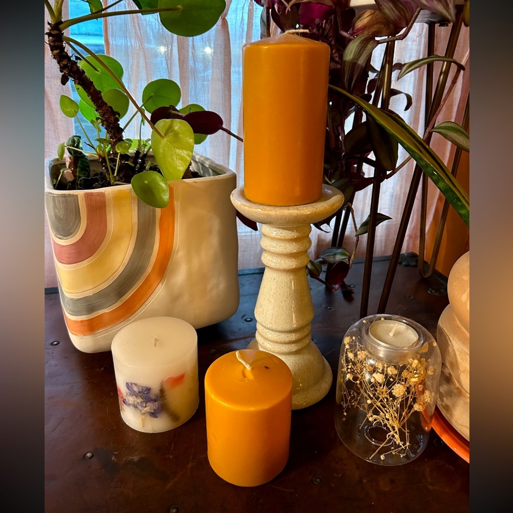 2 pillar candles with candle stick